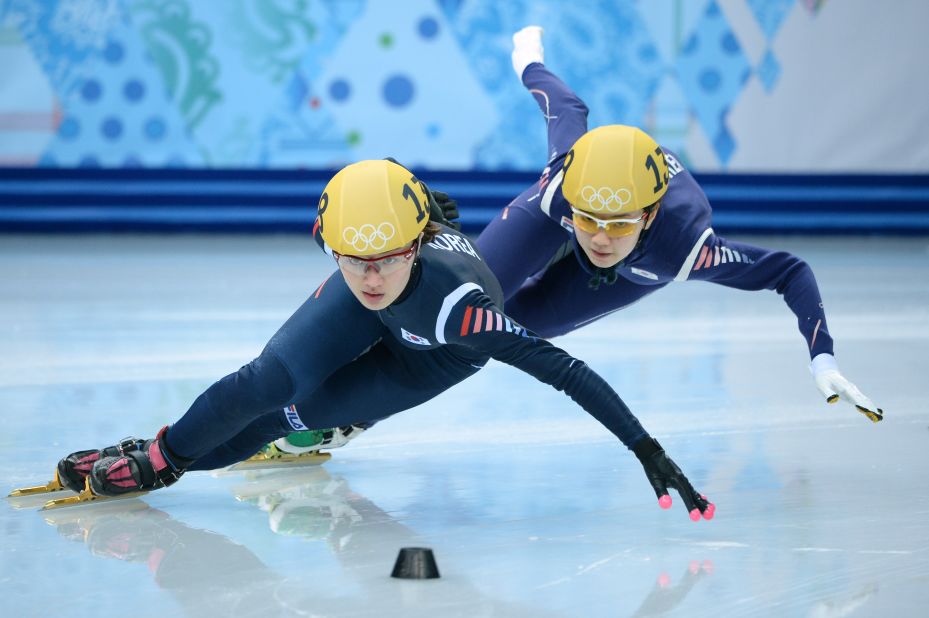 South Korea's Park Seung-Hi, left, and Shim Suk-Hee compete in the short track 1,000-meter final on February 21.
