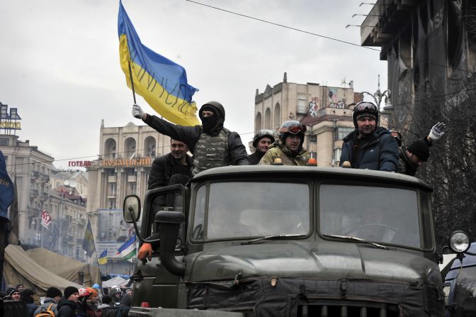 Anti-government protesters drive a military vehicle in Independence Square on February 22. Many protesters said they wouldn't leave the square until Yanukovych resigned.