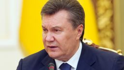 Ukrainian President Viktor Yanukovych delivers a speech in Kiev on February 14, 2014 as he met with veterans of the Soviet era war in Afghanistan to mark the 25th anniversary of the withdrawal of Soviet troops from Afghanistan. Anti-government protesters have occupied Kiev's central Independence Square for almost three months after President Viktor Yanukovych rejected a key EU trade pact in favour of closer ties with Russia. AFP PHOTO / GENYA SAVILOV        (Photo credit should read GENYA SAVILOV/AFP/Getty Images)