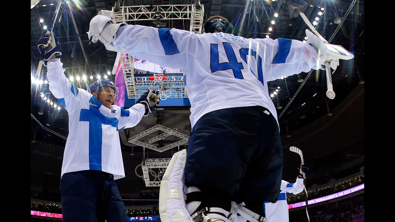 Finland's Tuukka Rask and Kimmo Timonen  celebrate after defeating the United States to take the bronze in men's ice hockey on February 22. 