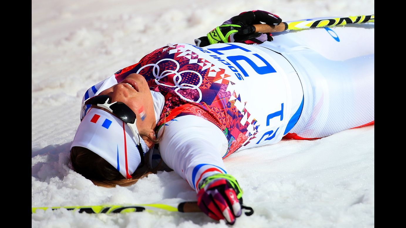 Coraline Hugue of France collapses after the women's 30-kilometer mass start free cross-country event on February 22. 