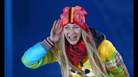 Amelie Kober of Germany, who got the bronze in ladies' snowboard parallel slalom, celebrates during the medal ceremony on February 22.