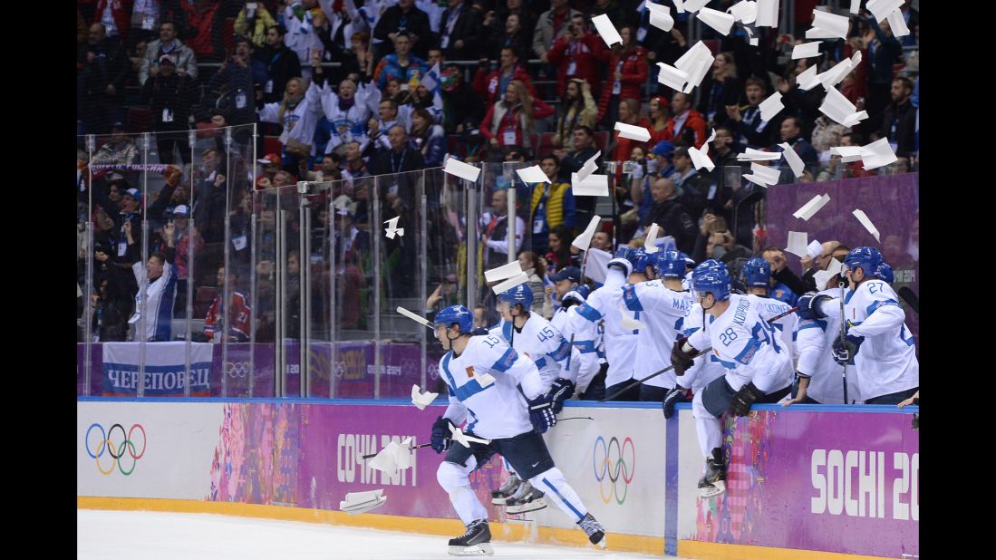 The Finnish men's hockey team celebrates a goal during the bronze medal game against the United States on February 22. 