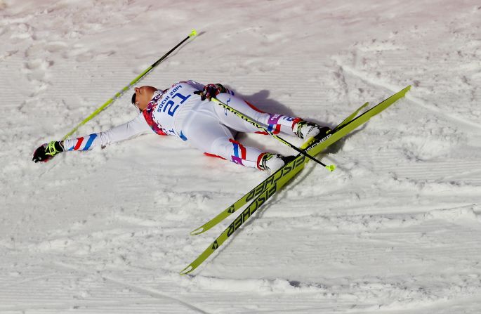 Coraline Hugue of France is exhausted on Saturday, February 22, after finishing seventh in the women's 30-kilometer mass start free cross-country event. 