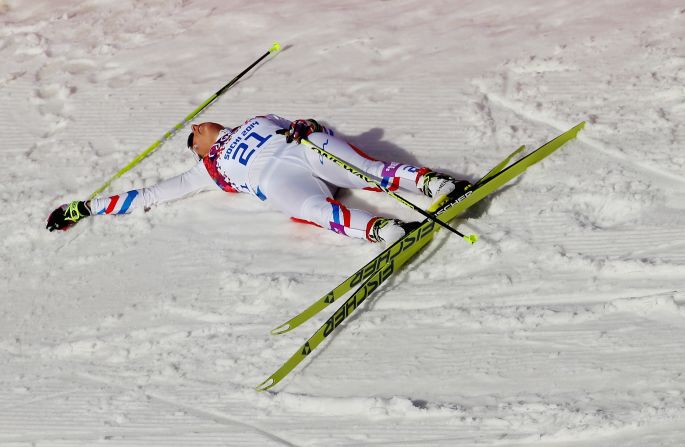 Coraline Hugue of France is exhausted on Saturday, February 22, after finishing seventh in the women's 30-kilometer mass start free cross-country event.