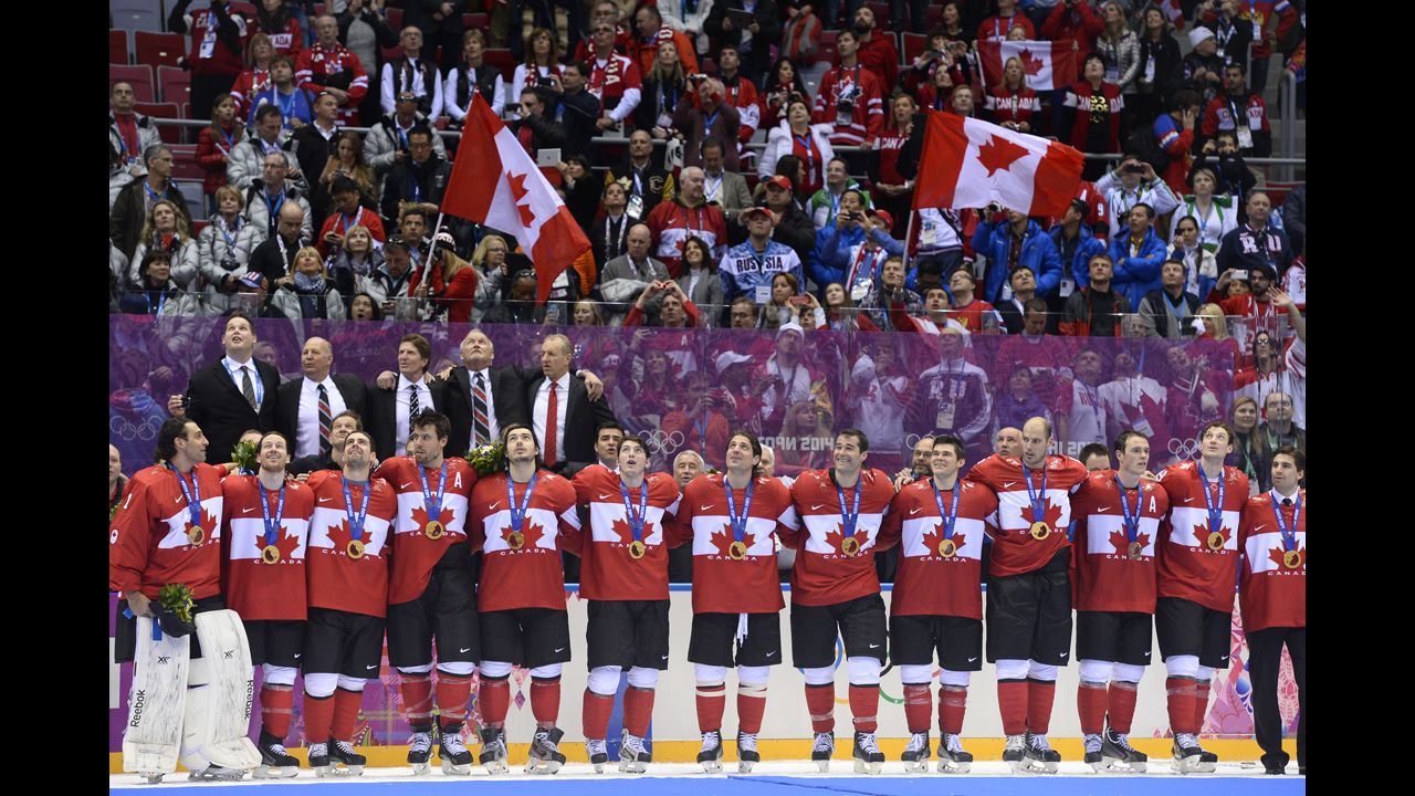 Canada's hockey team receives their gold medals in front of an ecstatic crowd on February 23.