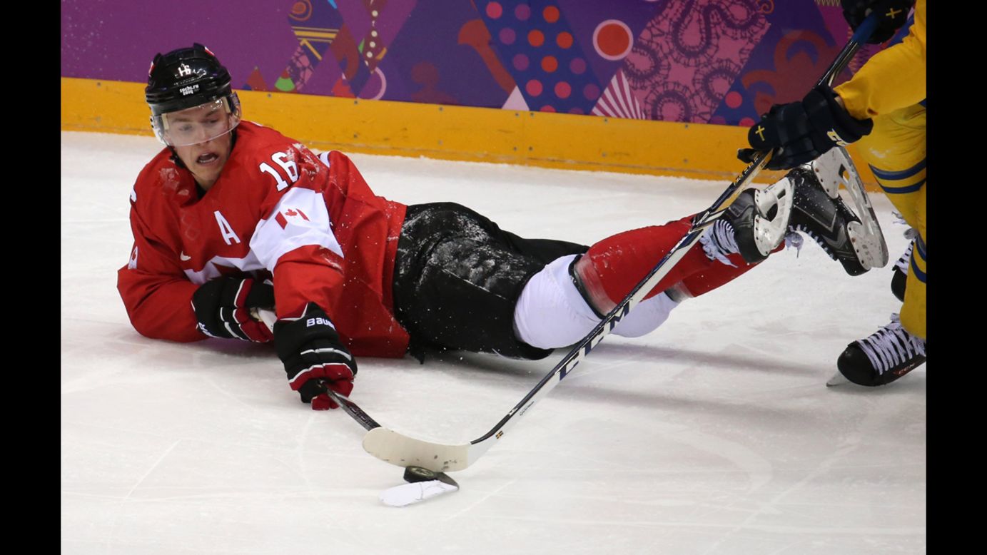 Canada forward Jonathan Toews fights for the puck in the second period of the gold medal men's hockey game against Sweden on Sunday, February 23. As world-class athletes <a href="http://www.cnn.com/2014/02/08/worldsport/gallery/visions-of-sochi/index.html">compete in the Winter Olympics</a>, we expect to see elegant and thrilling performances. But some finishes, in triumph, defeat or just plain exhaustion, often involve landing hard on a cold, wet surface. Here, we take a lighter look at those giving their all for a chance at the gold. | <em>More photos:</em> <a href="http://www.cnn.com/2014/02/08/worldsport/gallery/visions-of-sochi/index.html"><em>Visions of Sochi</em></a>