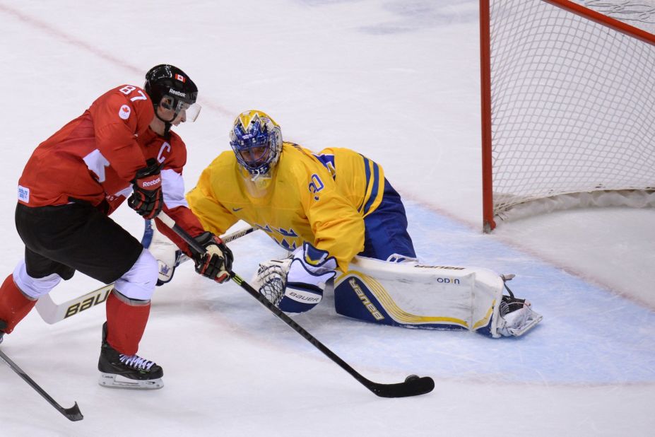 The Canadians also won the men's ice hockey title. Here Sidney Crosby scores past Sweden's goalkeeper Henrik Lundqvist during the final at the Bolshoy Ice Dome.