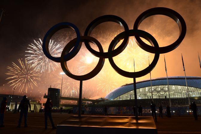 The Olympic rings are lit by fireworks as the closing ceremony comes to an end. 