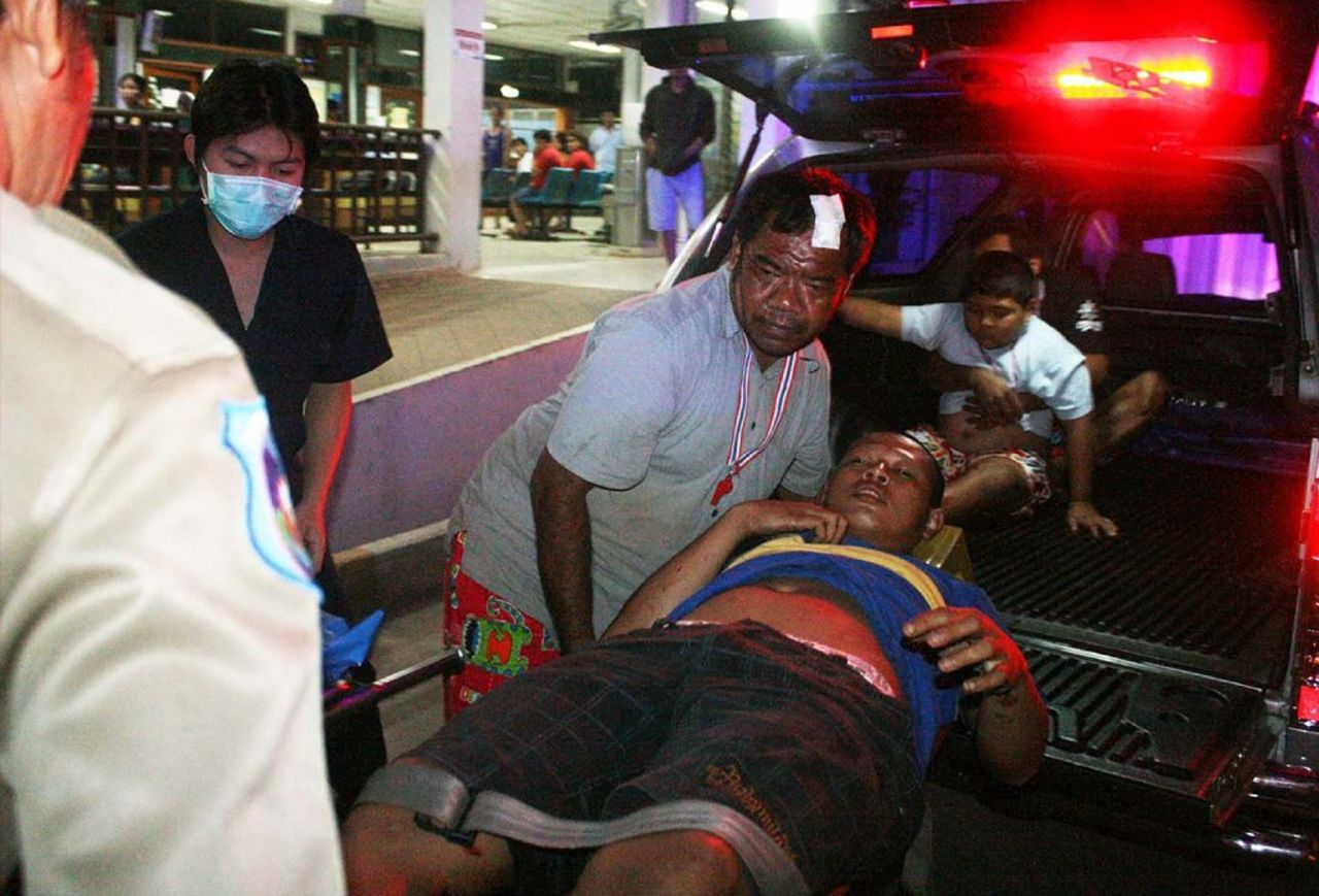 Hospital workers evacuate an injured villager after an attack near an anti-government rally in Khao Saming in Thailand's Trat province on Sunday, February 23. A 5-year-old girl was killed and more than 30 others wounded when attackers sprayed bullets on an anti-government rally in eastern Thailand, police said. 