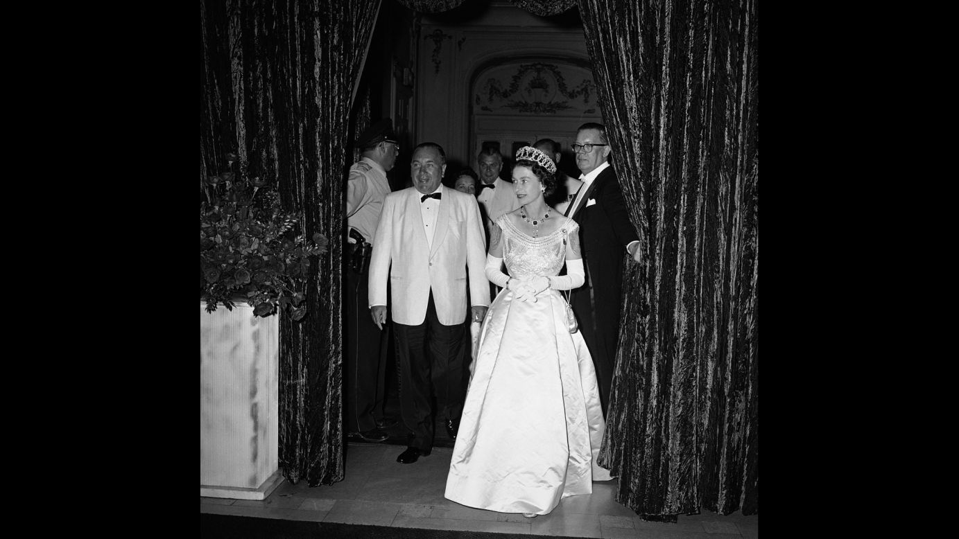 Queen Elizabeth II enters the Grand Ballroom of the Hilton Hotel in Chicago on July 6, 1959. She was attending a banquet held by Chicago Mayor Richard J. Daley, seen at left in the bow tie. Daley and his son, Richard M. Daley, presided over Chicago as mayor for 42 combined years.