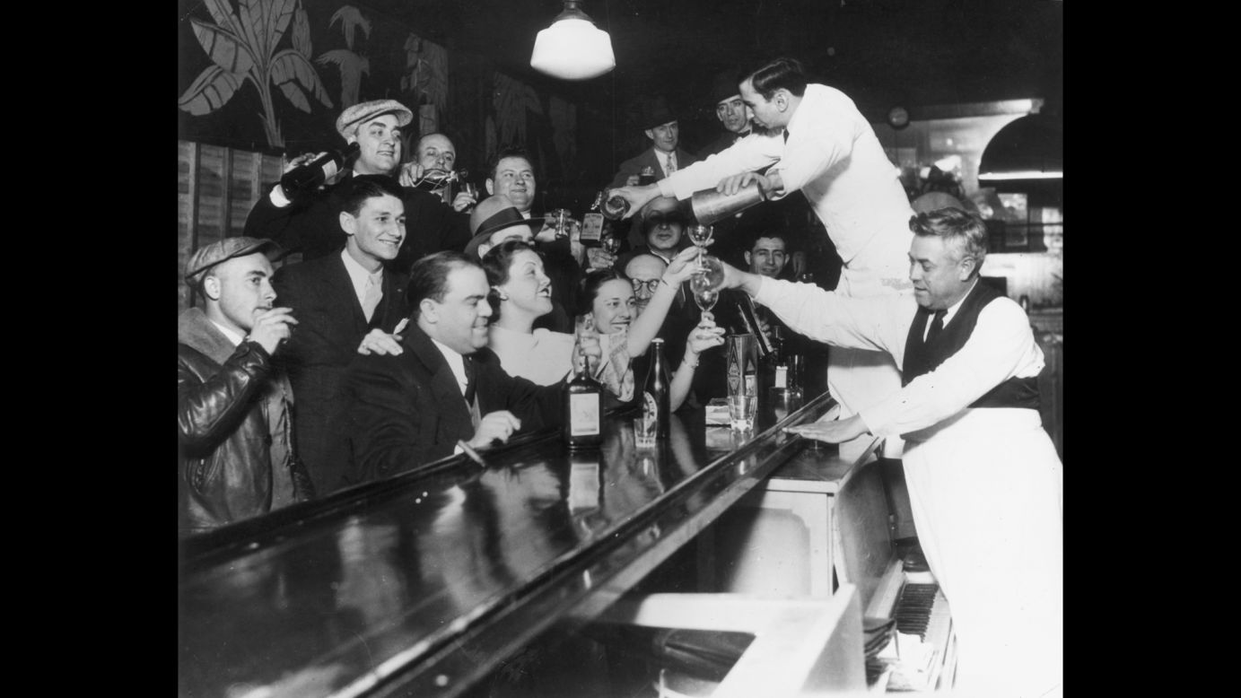 Bartenders at Sloppy Joe's bar in downtown Chicago pour a round of drinks in 1933 to celebrate the repeal of the 18th Amendment and the end of the Prohibition era.
