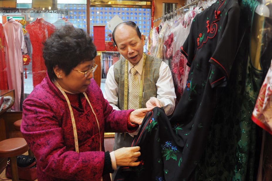 Master tailor Leung Ching-wah (here with wife Joana Fung) suggests longer sleeves for customers conscious of their arms and a higher waistline for those who wish to hide their stomachs.