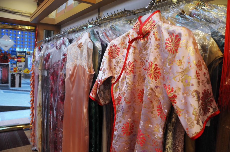 At Hong Kong cheongsam shops, customers choose a style off the rack before deciding on details such as flower buttons on the placket, sleeve length and slit depth. 