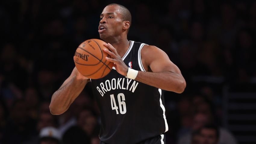 LOS ANGELES, CA - FEBRUARY 23:  Jason Collins #46 of the Brooklyn Nets handles the ball against the Los Angeles Lakers at Staples Center on February 23, 2014 in Los Angeles, California. NOTE TO USER: User expressly acknowledges and agrees that, by downloading and or using this photograph, User is consenting to the terms and conditions of the Getty Images License Agreement.  (Photo by Jeff Gross/Getty Images) *** Local Caption *** Jason Collins