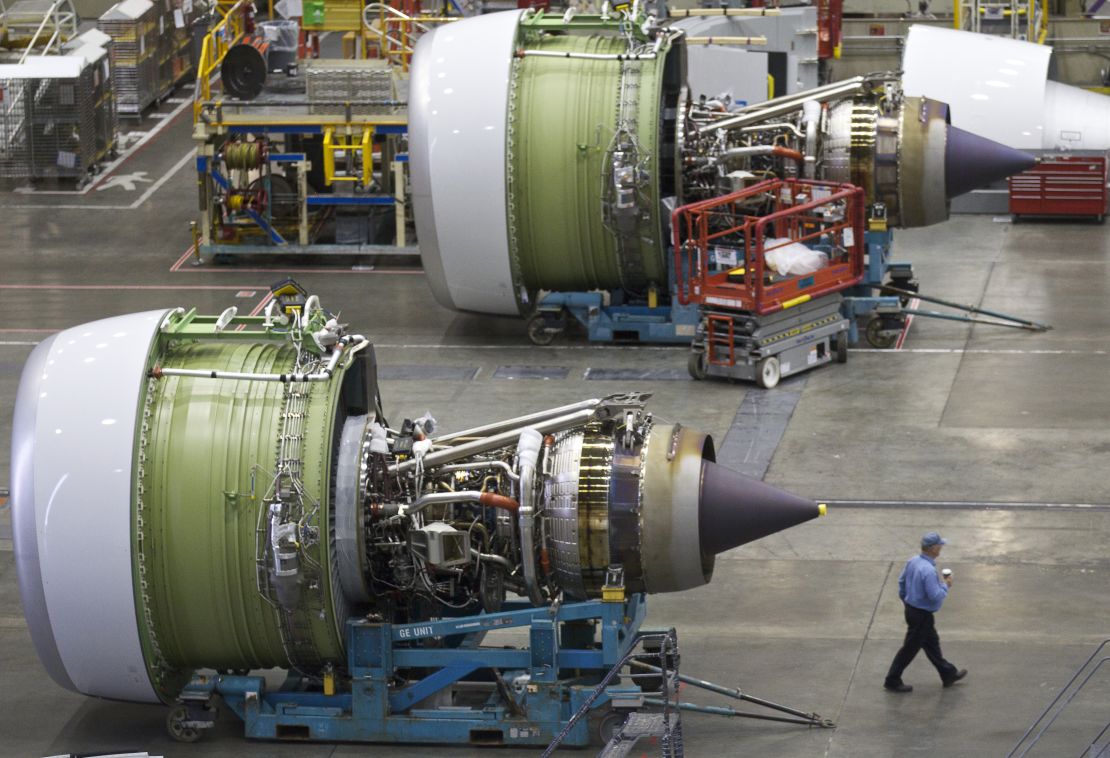 A GE90-115B jet engine dwarfs a Boeing worker. Guinness calls it the most powerful commercially produced jet engine in the world.
