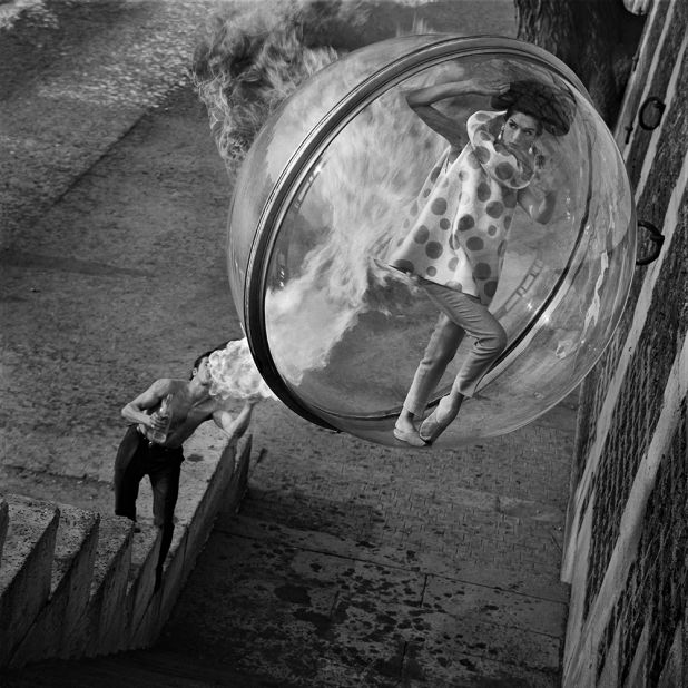 The photos start with models suspended over river Seine, then moves into the city streets, evoking adventurous, surreal imagery.