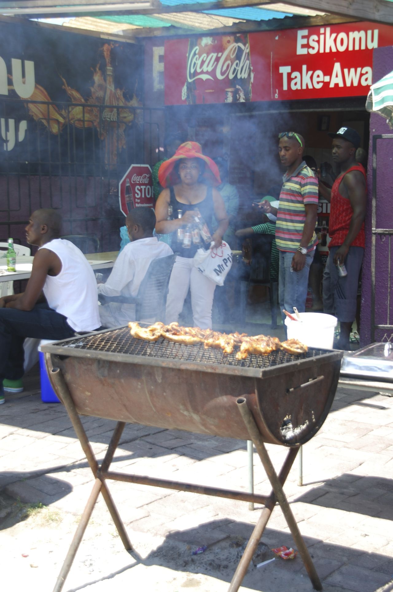 Best thing about braais? Their anytime, anywhere utility. This one's in Gugulethu in Cape Town. 