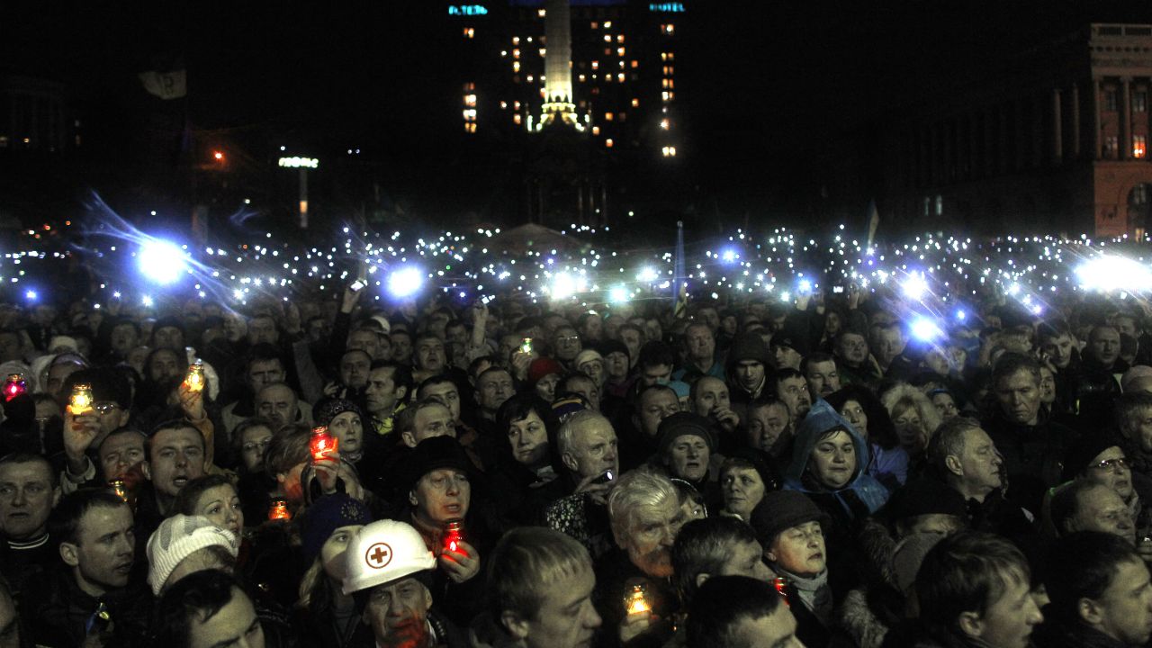 People turn on cell phones and flash lights in Independence Square in Kiev, Ukraine on February 22, 2014.