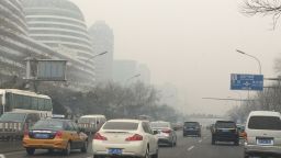 Smog blankets Beijing traffic