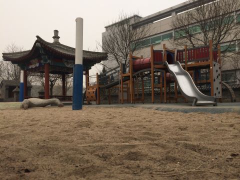 An empty playground at the International School of Beijing as students are kept indoors due to heavy smog.