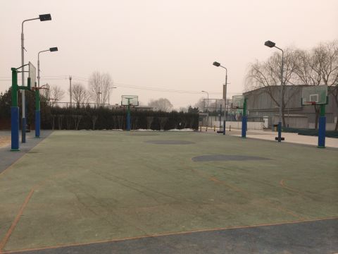 Basketball courts in the city lie deserted as pollution levels reach dangerous levels.