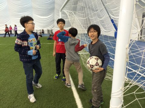Soccer practice is held on artificial turf under the dome.