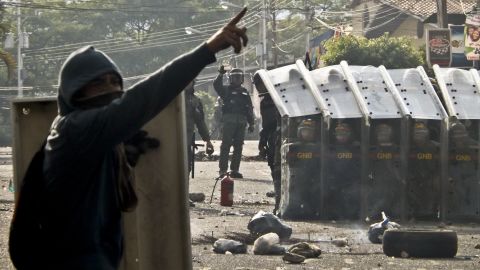 Protesters face National Guard troops in San Cristobal, Venezuela, on February 21.
