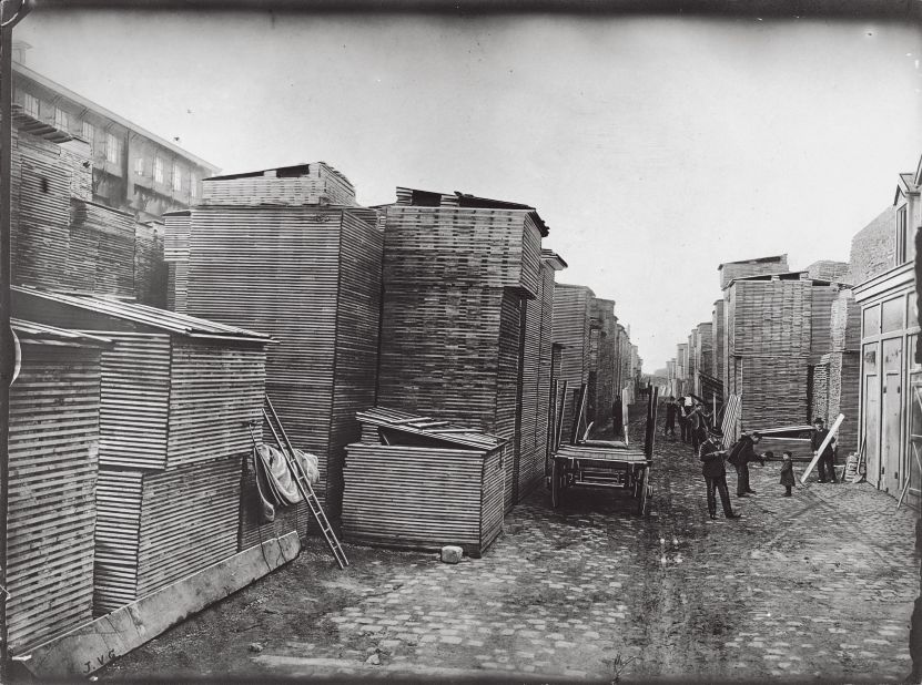 The town of Asnières was chosen as the location of Louis Vuitton's workshop because of its convenient transport links - it sits  along the Seine, and is connected to Paris by rail. Here, a 1903 photo shows poplar boards used for manufacturing of trunks unloaded from a barge.  