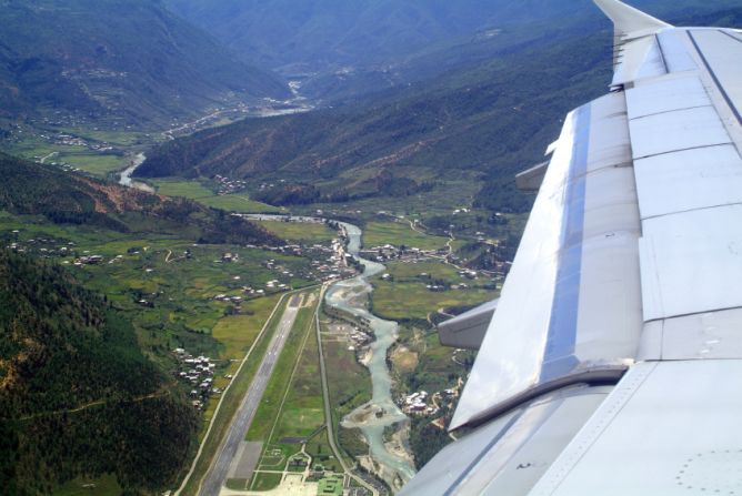 The plunge into this steep valley containing secluded Bhutan's only international airport is as beautiful as it is challenging -- only eight pilots in the world are qualified to land here.
