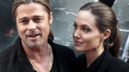 US actors Brad Pitt (L) and Angelina Jolie pose upon their arrival for the premiere of 'World War Z' on the Champs Elysees Avenue in Paris on June 3, 2013. AFP PHOTO / JACQUES DEMARTHON (Photo credit should read JACQUES DEMARTHON/AFP/Getty Images)