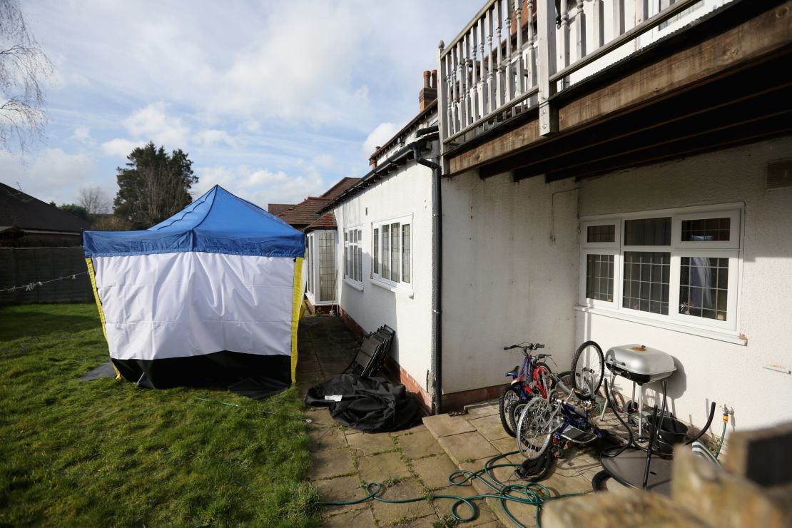 A police forensic tent sits in the garden of Moazzam Begg's house in Birmingham, England. 
