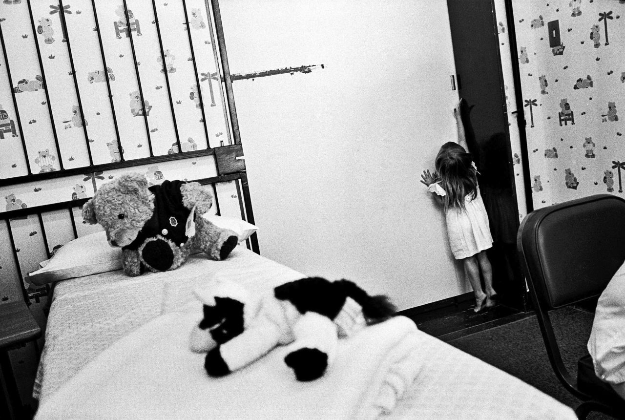 A young girl attempts to flee a doctor's room before a medical forensic examination in Johannesburg. Her relative, a nine-year-old, admitted to playing "sexual games" with her and was later discovered to himself have been sexually abused.
