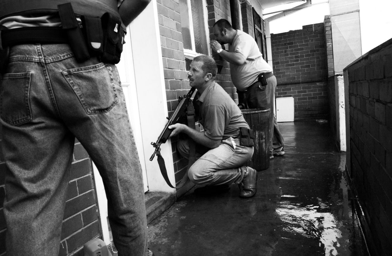 Police prepare to raid a Johannesburg apartment where they believed children were being forced into prostitution.