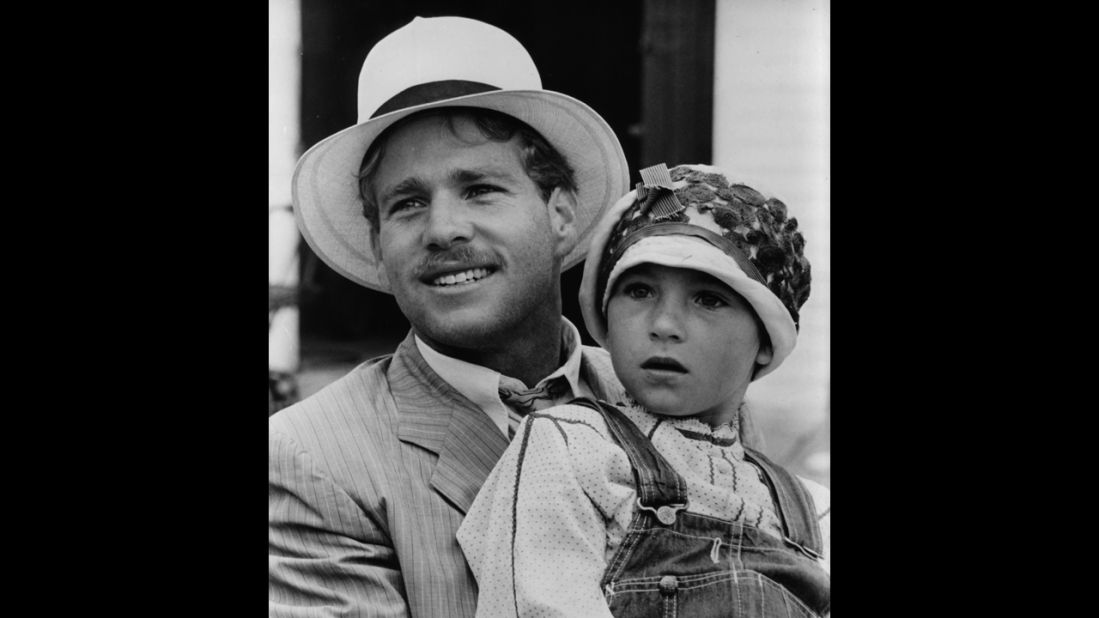 Tatum O'Neal, being held by father Ryan, is the youngest winner of an acting category. She was 10 when she won best supporting actress for "Paper Moon" (1973).