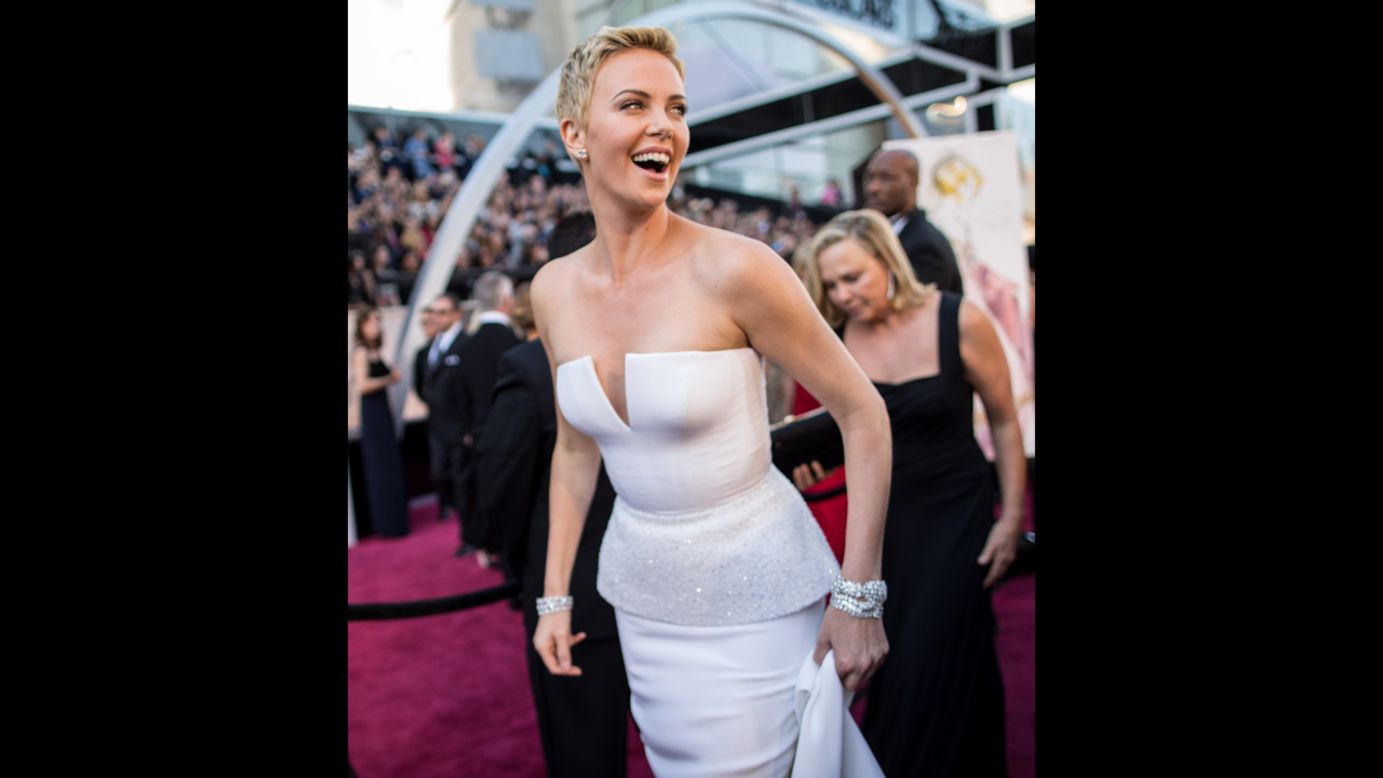 Some actresses rely on their hair to help tell their fashion story at the Oscars, but Charlize Theron didn't need much assistance in 2013. The actress, who'd cut her locks super-short to film "Mad Max: Fury Road," rocked the haircut at the awards show with a white strapless dress that was just as architecturally chic. 