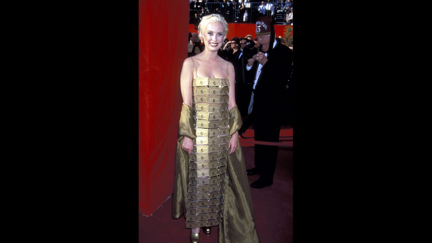 On one hand, Lizzy Gardiner's dress of American Express Gold Cards is certainly ... inspired. The costume designer crafted her own gown in 1995, when she won the best costume design Oscar for "Priscilla, Queen of the Desert." But c'mon, Lizzy -- if you could afford that gold wrap, you could afford enough fabric for an actual dress.