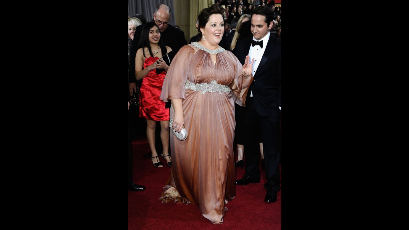 We love Melissa McCarthy so much that we've pre-emptively pledged to see each and every one of her movies, including the poorly reviewed ones. That is why it pained us to see her wear this awkward dress to the 2012 Oscars.