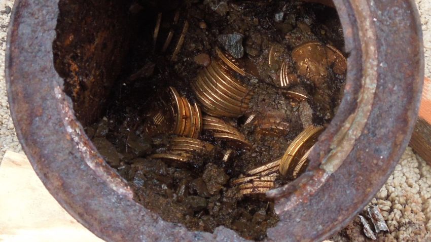 Decaying metal canisters filled with 1800s-era U.S. gold coins were unearthed in California by two people who wish to remain anonymous.