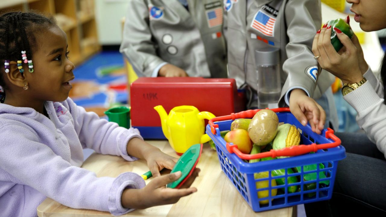 Oumou Balde, 4, left, takes part in a pre-kindergarten nutrition program in New York.