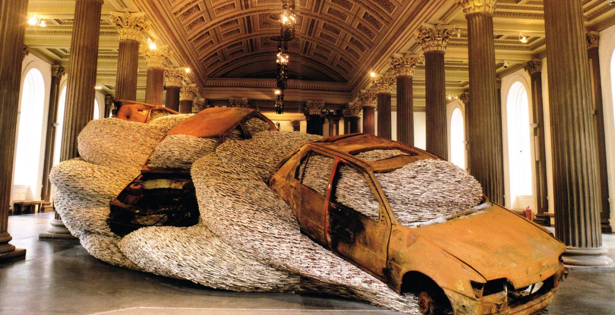A work titled "Bangers 'N' Mash" on display in Glasgow depicts wrecked cars filled with magazines.