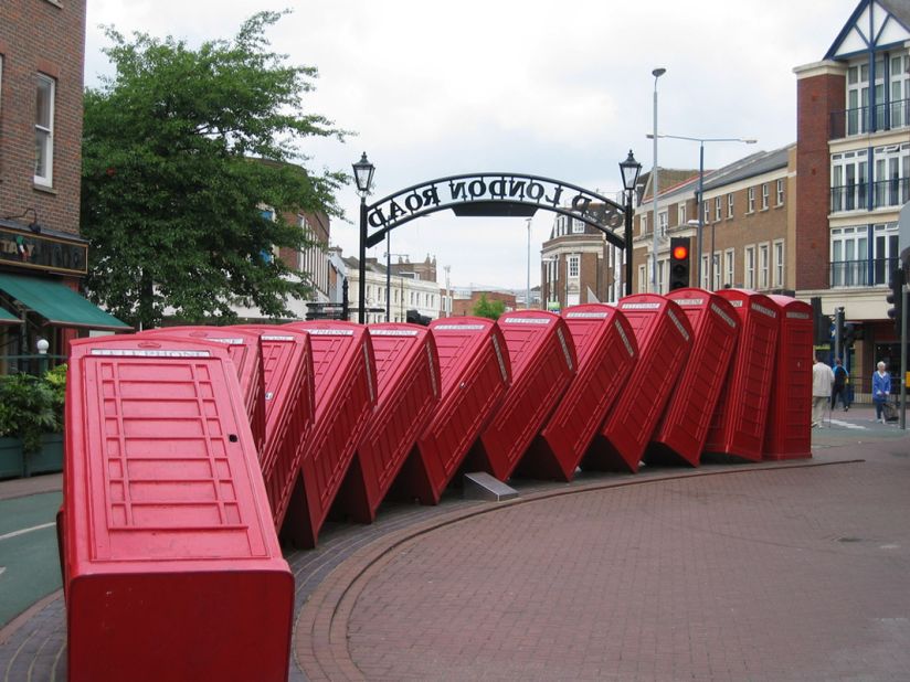 A domino effect appears to occur with his "Out of Order" artwork in London, of old red phone boxes piled up on top of one another.