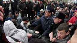 Police try to separate pro and anti-Russian activists in front of Crimean regional parliament in Simferopol on February 26, 2014.