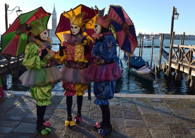 Every year up to three million visitors swarm the <a href="index.php?page=&url=http%3A%2F%2Fwww.carnevale.venezia.it%2F%3Fslang%3Den" target="_blank" target="_blank">Carnival of Venice</a>, a giant masquerade party that lasts for more than two weeks. Revelers mingle at cultural events and let loose at riotous street parties. No costume is complete without a mask or, in this instance, a court jester's parasol.