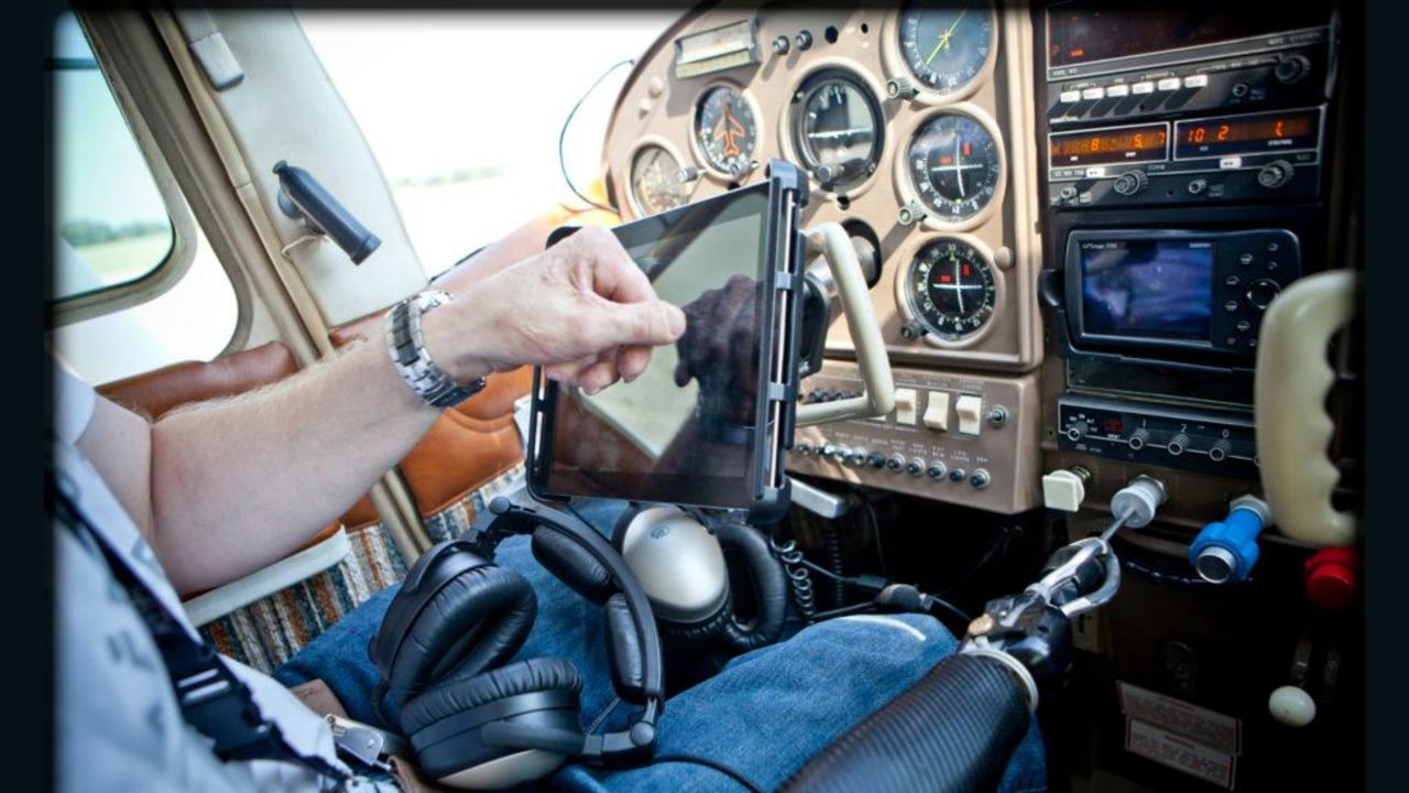 Thomas uses his prosthetic arm and hook to control the plane's engine and instruments.