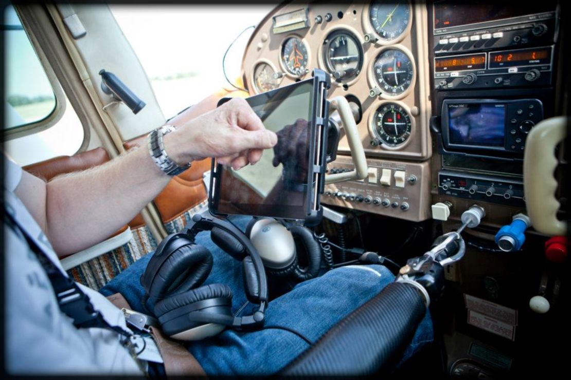 Thomas uses his prosthetic arm and hook to control the plane's engine and instruments.
