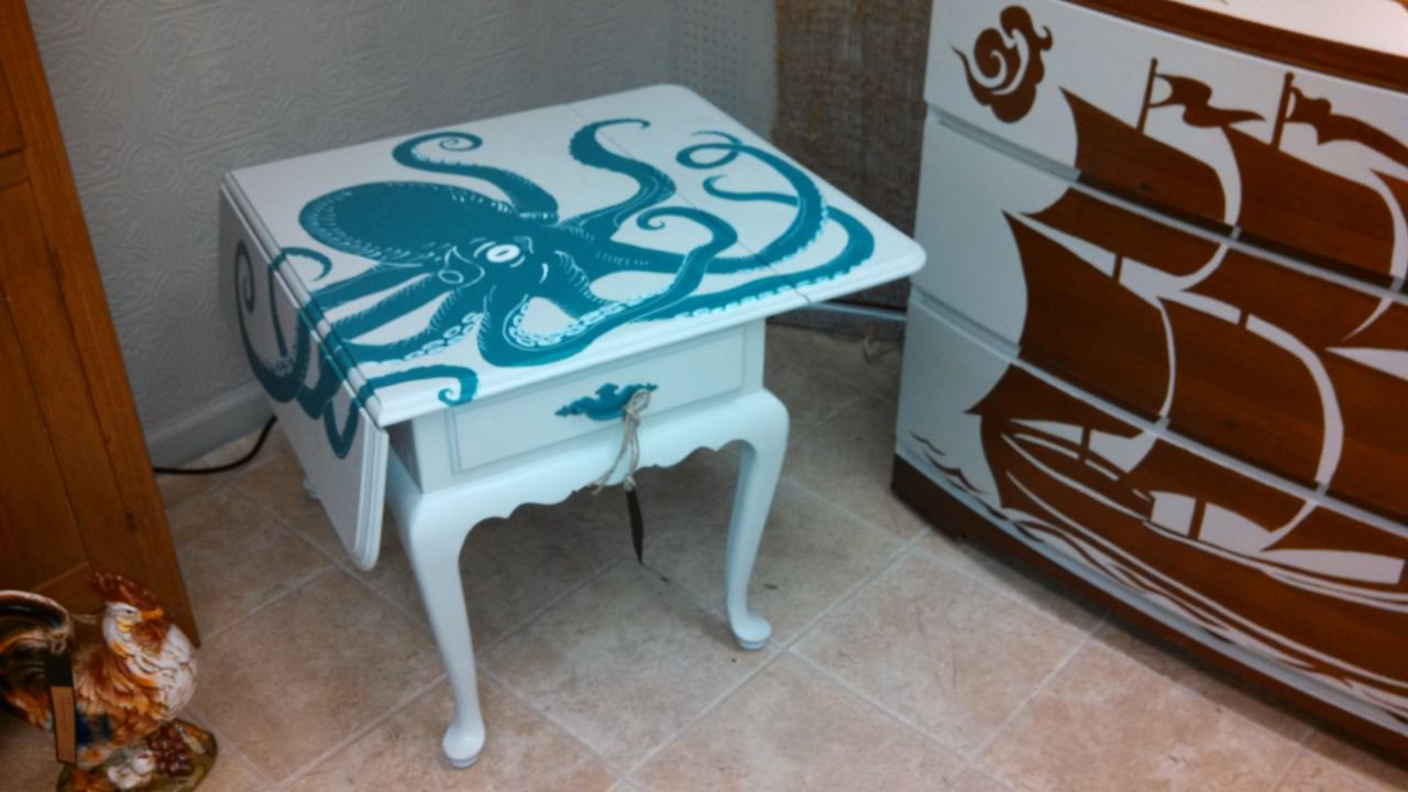 Kristie Rackliffe's reimagined octopus table and boat dresser in her booth at the Queen of Hearts antique mall.