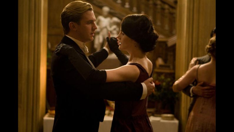 Lady Mary Crawley dances with soon-to-be fiance Matthew. This elegant shot silk dress is on view in "Costumes of Downton Abbey," an exhibition at Winterthur Museum, Garden and Library in Delaware. The engagement scene from the show is projected alongside the display of the dress and Matthew's evening wear. 