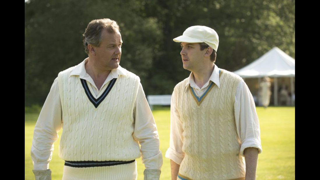 Lord Grantham and Matthew wear cable knit vests for a cricket match.