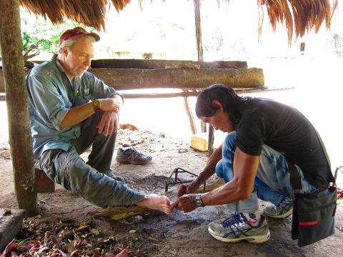 Dr. Mark Plotkin is treated and cured of a foot injury by Amasina, paramount shaman of the Trio tribe in southwestern Suriname.